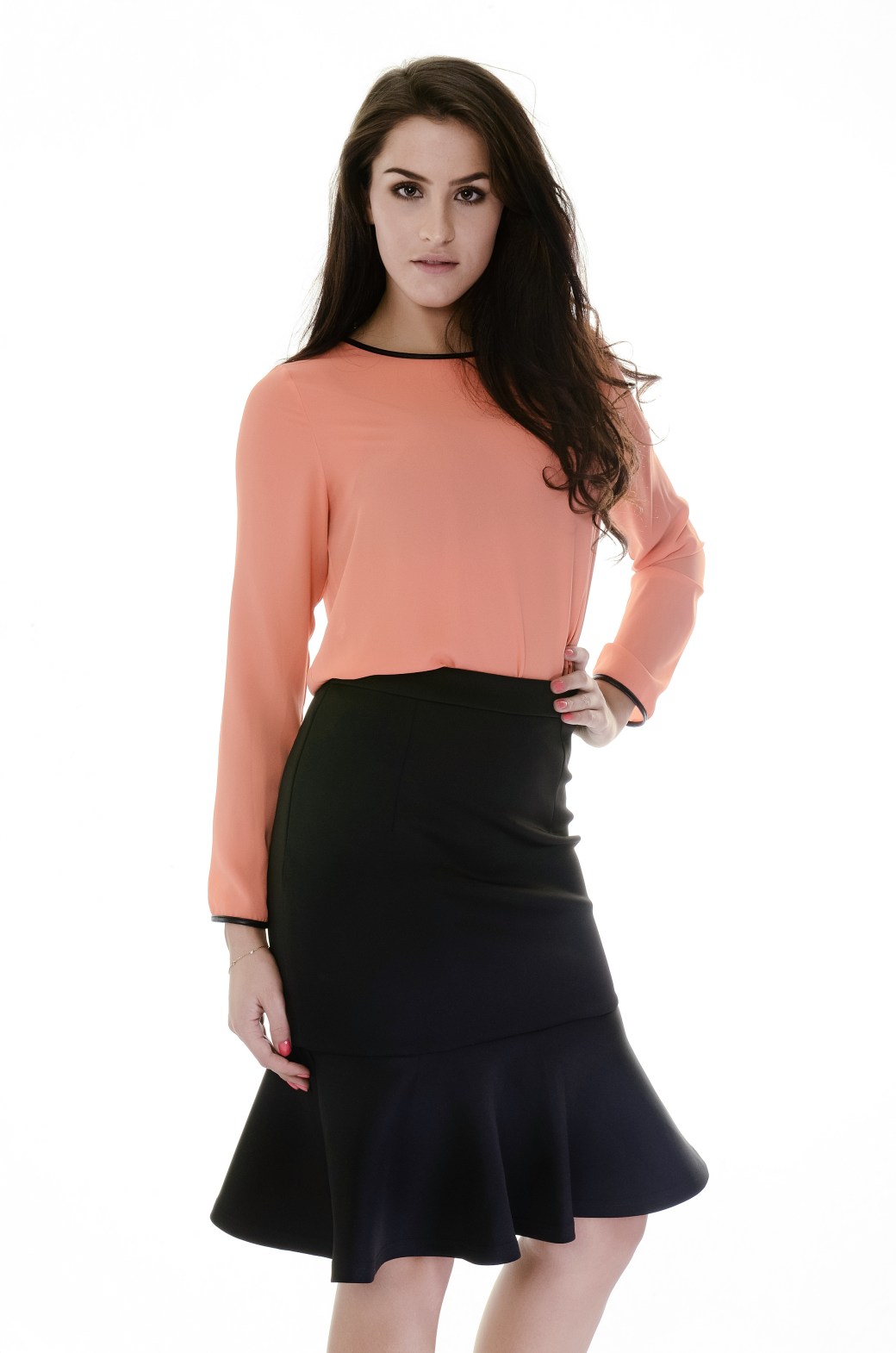 peach top with black peplum skirt